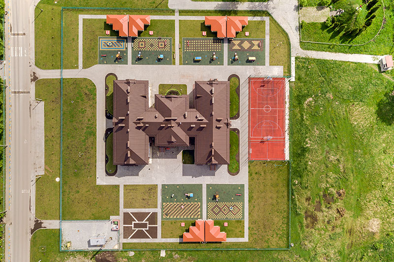top-aerial-view-of-new-preschool-building-and-yard-2023-11-27-04-55-27-utc